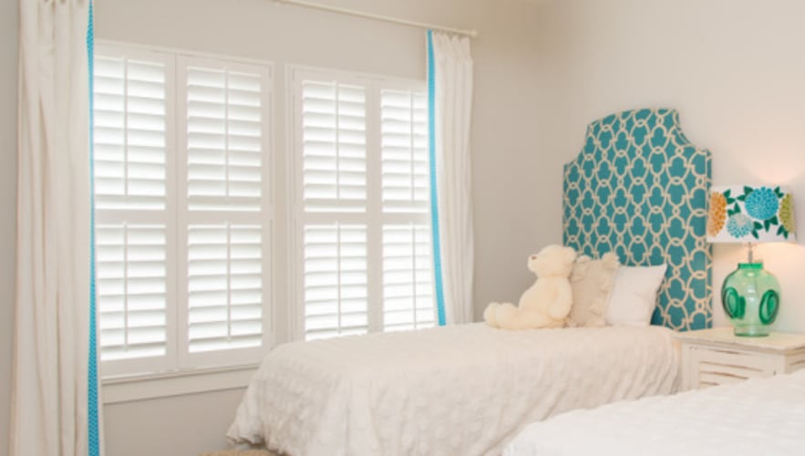 Plantation shutters in a bedroom